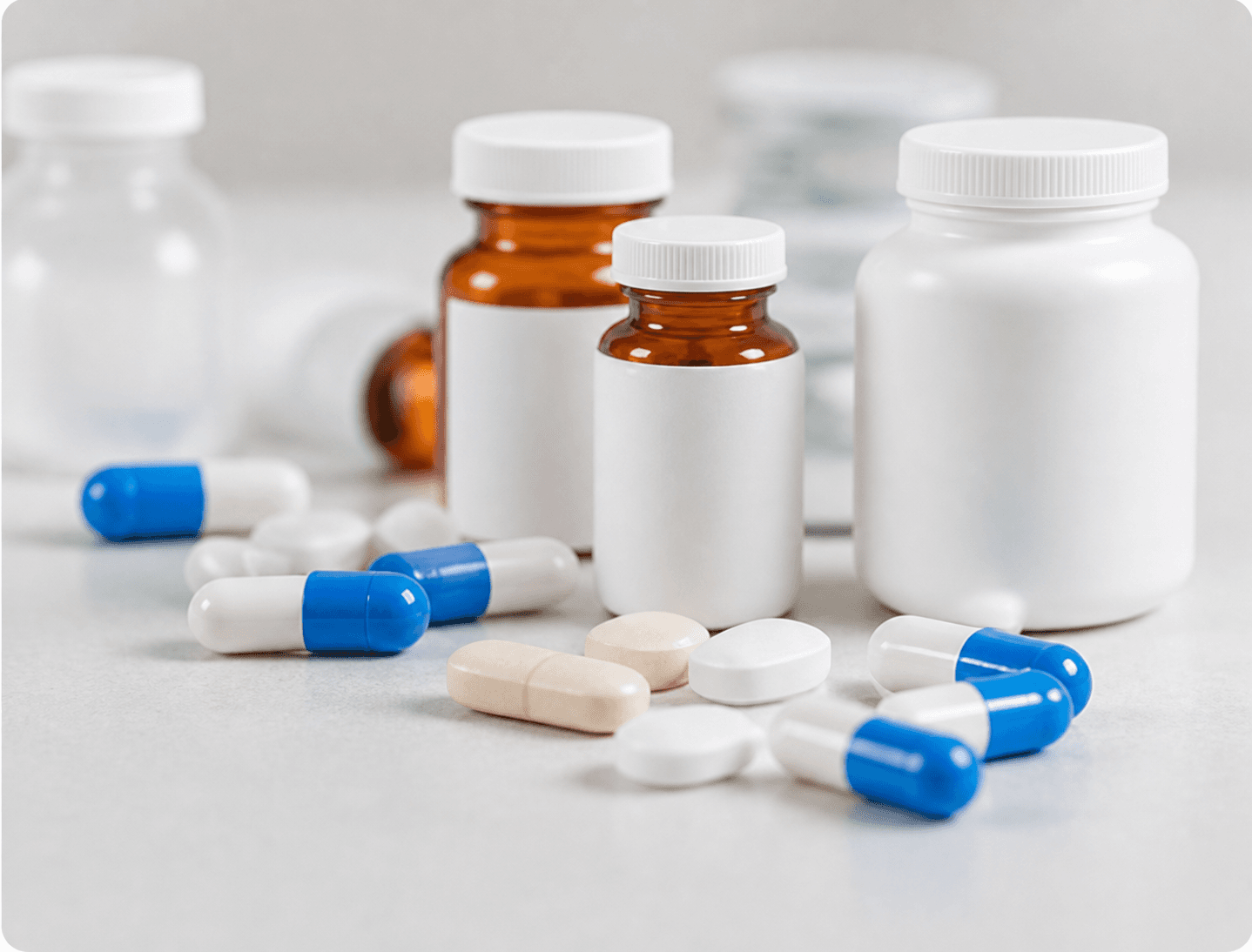 Medicine bottles, capsules and tablets on a counter